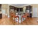Elegant kitchen featuring a granite countertop island with dark cabinets and barstool seating at 4437 Blue Ridge Dr, Douglasville, GA 30135