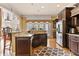 Spacious kitchen featuring dark wood cabinetry and stainless steel appliances at 4437 Blue Ridge Dr, Douglasville, GA 30135