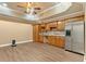 Basement kitchenette featuring wood cabinets, granite countertops, stainless steel appliances, and wood flooring at 4437 Blue Ridge Dr, Douglasville, GA 30135