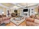 Elegant living room featuring hardwood floors, fireplace, coffered ceilings, and ornate furnishings at 4437 Blue Ridge Dr, Douglasville, GA 30135