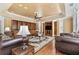 Inviting living room featuring built-in bookshelves and a cozy seating area with hardwood floors at 4437 Blue Ridge Dr, Douglasville, GA 30135