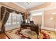Elegant office featuring a large window, ornate curtains, and a classic desk at 4437 Blue Ridge Dr, Douglasville, GA 30135