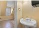 Comfortable powder room with pedestal sink and small window at 4437 Blue Ridge Dr, Douglasville, GA 30135