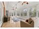 Charming sunroom with tile floors, lots of windows, and comfortable seating at 4437 Blue Ridge Dr, Douglasville, GA 30135