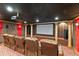 Luxurious home theater featuring comfortable seating, a projector, and elegant decor at 4437 Blue Ridge Dr, Douglasville, GA 30135