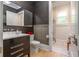 Stylish bathroom featuring a modern vanity, wood accents, and a glass-enclosed shower at 515 Danube Ne Rd, Atlanta, GA 30342