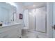 Bathroom featuring marble floors, shower with glass doors, white vanity, and toilet at 515 Danube Ne Rd, Atlanta, GA 30342
