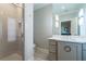 Bright bathroom featuring glass enclosed shower, neutral vanity, and modern accents at 515 Danube Ne Rd, Atlanta, GA 30342