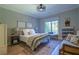 Inviting bedroom with a cozy window seat, natural light, and hardwood floors at 515 Danube Ne Rd, Atlanta, GA 30342