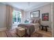 Comfortable bedroom with a bed, rug, and large window at 515 Danube Ne Rd, Atlanta, GA 30342