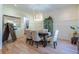 Elegant dining room featuring contemporary lighting, wainscotting, hardwood flooring, and stylish decor at 515 Danube Ne Rd, Atlanta, GA 30342