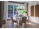 Dining area with stylish chairs, a marble table, and natural light from the large window at 515 Danube Ne Rd, Atlanta, GA 30342