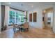 Bright dining room featuring a chandelier, a round table, and large windows at 515 Danube Ne Rd, Atlanta, GA 30342