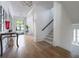 Inviting foyer with gleaming hardwood floors, staircase, and a view into other rooms of the house at 515 Danube Ne Rd, Atlanta, GA 30342