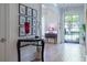 Elegant foyer with hardwood floors, a stylish console table, and a bright view through the front door at 515 Danube Ne Rd, Atlanta, GA 30342