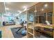 Home gym featuring a treadmill, elliptical, free weights, mirrors, and a full infrared sauna at 515 Danube Ne Rd, Atlanta, GA 30342