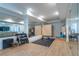 Home gym showcasing weights, mirrors, workout machine, infrared sauna, and wood-look floors at 515 Danube Ne Rd, Atlanta, GA 30342