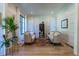 Bright living room featuring large windows, wainscotting, neutral decor, and hardwood flooring at 515 Danube Ne Rd, Atlanta, GA 30342