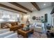 Cozy living room with a leather couch, white chairs, and a wooden coffee table at 515 Danube Ne Rd, Atlanta, GA 30342