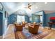 Elegant living room with vaulted ceiling, a cozy seating area, and blue walls at 515 Danube Ne Rd, Atlanta, GA 30342