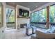 Relaxing outdoor living area with a fireplace, TV, and comfortable seating at 515 Danube Ne Rd, Atlanta, GA 30342