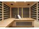 Interior view of sauna with wood paneling, bench seating, water bottle, and towel at 515 Danube Ne Rd, Atlanta, GA 30342