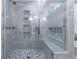 Luxurious marble shower with built-in bench and shelving at 515 Danube Ne Rd, Atlanta, GA 30342