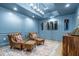 Beautiful wine room features cozy armchairs, ample wine storage, recessed lights, and sophisticated decor at 515 Danube Ne Rd, Atlanta, GA 30342