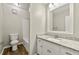 Bathroom with granite countertop, white vanity and updated fixtures and tile at 2802 Oak Meadow Ln, Snellville, GA 30078