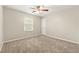 Bedroom with neutral carpet, one window, and a ceiling fan at 2802 Oak Meadow Ln, Snellville, GA 30078