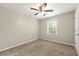 Bedroom with neutral carpet, one window, and a ceiling fan at 2802 Oak Meadow Ln, Snellville, GA 30078