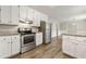Well-equipped kitchen featuring granite countertops, stainless steel appliances, and updated cabinets at 2802 Oak Meadow Ln, Snellville, GA 30078