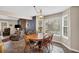 Bright dining area with wood table, seating for six, and big windows with views of the back yard at 4565 Canebrake Ct, Powder Springs, GA 30127