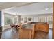 Kitchen and dining area includes natural wood cabinets, bar seating, and an abundance of natural light at 4565 Canebrake Ct, Powder Springs, GA 30127