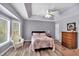 Bright main bedroom features a trey ceiling, ample windows, and wood-look flooring at 4565 Canebrake Ct, Powder Springs, GA 30127