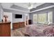 The main bedroom features neutral walls, wood-look floors, and a trey ceiling at 4565 Canebrake Ct, Powder Springs, GA 30127