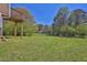 Expansive backyard featuring a lush green lawn and mature trees, perfect for outdoor activities and relaxation at 5219 Sweet Air Ln, Stone Mountain, GA 30088