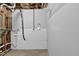 Unfinished basement area with exposed pipes and white brick, offering potential for customization and storage at 5219 Sweet Air Ln, Stone Mountain, GA 30088