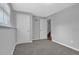 Carpeted bedroom with two closets, neutral color, and window at 5219 Sweet Air Ln, Stone Mountain, GA 30088
