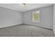 Bedroom with carpet, window and neutral color scheme at 5219 Sweet Air Ln, Stone Mountain, GA 30088