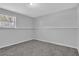 Cozy bedroom featuring soft carpeting, a bright window, and fresh paint, creating a comfortable atmosphere at 5219 Sweet Air Ln, Stone Mountain, GA 30088