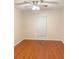 Cozy bedroom featuring hardwood floors and a window providing natural light at 919 Dunbar Dr, Dunwoody, GA 30338