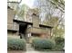 Charming multi-story apartment building with balconies and landscaped grounds at 919 Dunbar Dr, Dunwoody, GA 30338