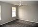 Bright bedroom featuring plush carpeting, a ceiling fan and neutral paint, ready for relaxation at 253 Woodland Way, Canton, GA 30114