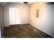 View of empty garage with concrete floor and white bifold door to utility closet at 253 Woodland Way, Canton, GA 30114