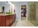 Bathroom with granite countertops, walk-in shower, and a view of the walk-in closet at 2766 Birch Grove Se Ln # 11, Marietta, GA 30067