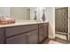 Bathroom features a gray vanity with white countertop, framed mirror, and shower with curtain at 2766 Birch Grove Se Ln # 11, Marietta, GA 30067