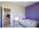 Bedroom with purple accent wall, and a view into the other rooms at 2766 Birch Grove Se Ln # 11, Marietta, GA 30067
