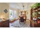 Elegant dining room featuring hardwood floors, a bay window with plantation shutters, and decorative shelving at 2766 Birch Grove Se Ln # 11, Marietta, GA 30067