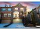 Inviting two-story brick townhouse with a front-facing garage and charming architectural details at 2766 Birch Grove Se Ln # 11, Marietta, GA 30067